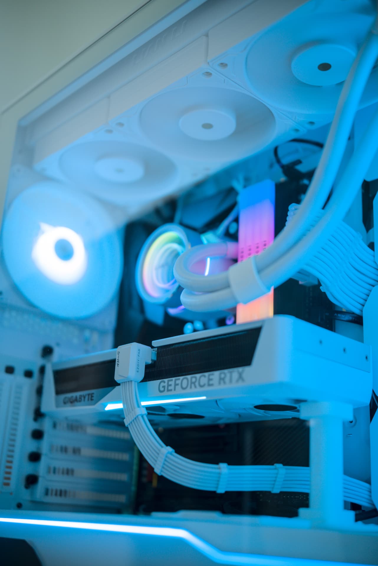Gaming PC build with teal RGB lighting